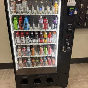 Dixie Narco BevMax 5591 Glass Front Beverage Vending Machine with credit card reader.